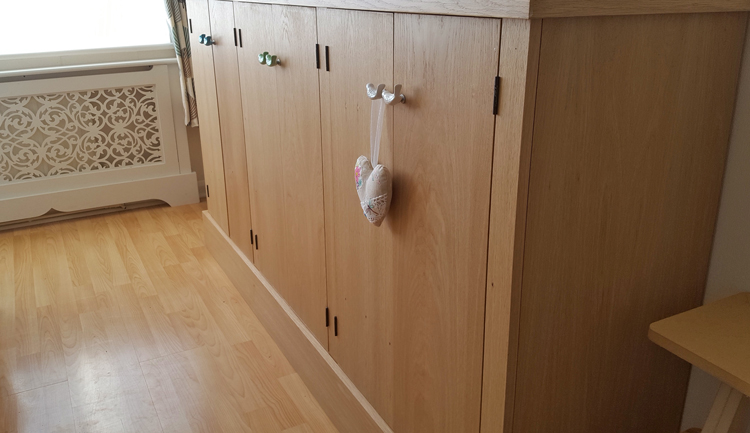 Jali bespoke radiator cover and real oak veneer cupboard