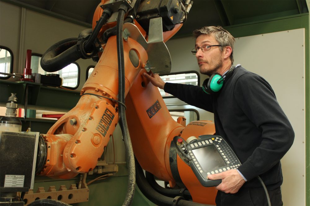 Nicholas Showan programming the Kuka robot
