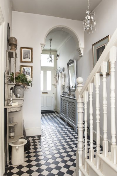 Jali Radiator Cover in classic tiled hallway