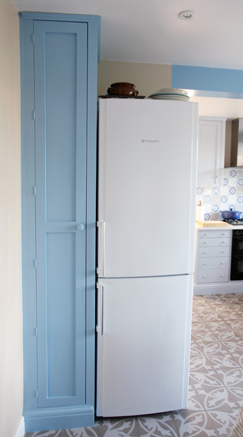 Tall Jali cupboard besides kitchen fridge