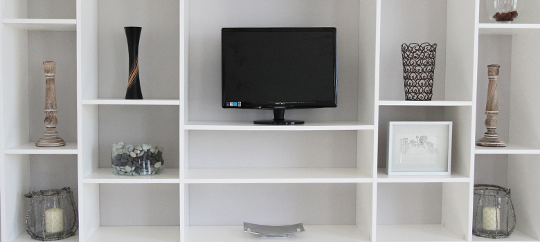 Jali bespoke shelving unit with ornaments and TV