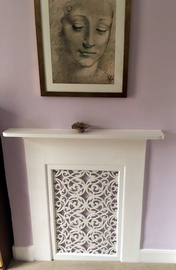 Bespoke Jali fretwork panel transforms an unused fireplace