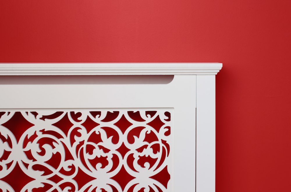 Ornate Jali Radiator Cover on red wall