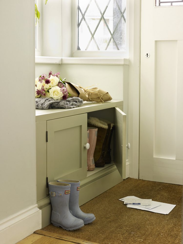 Jali shoe cupboard doubles as a seat in alcove