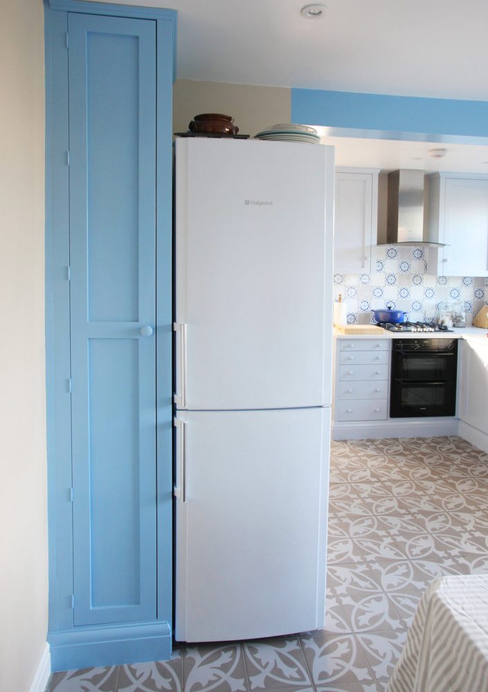 Tall blue Jali Cupboard in kitchen